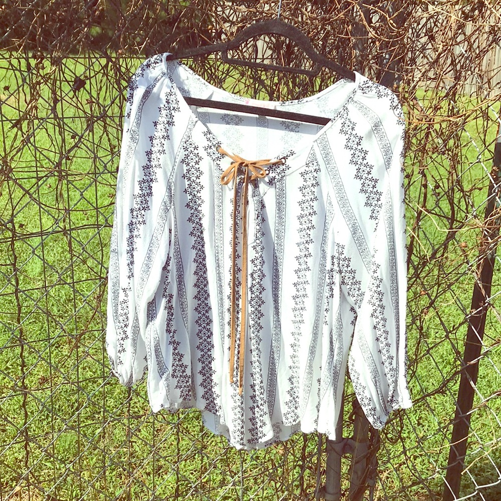 Quarter length blouse.